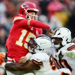 Cleveland Browns defensive tackle Mike Hall Jr. (No. 51) and linebacker Devin Bush (No. 30) converge on Kansas City Chiefs quarterback Patrick Mahomes during an NFL Week 15 game at Huntington Bank Field in Cleveland, Ohio on Sunday, Dec. 15, 2024.